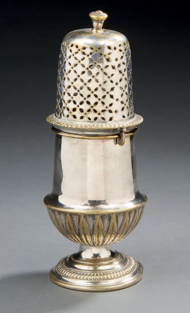 null A silver plated bronze SAUPOUDROIR. It rests on a gadrooned foot, the decoration...