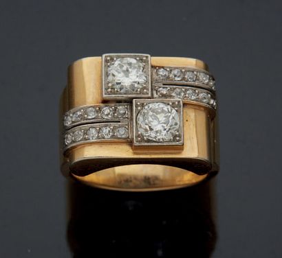 null A 750 mm yellow gold and platinum HORSE RING set with two geometric motifs composed...