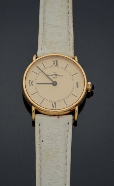 BAUME & MERCIER. MONTRE d'homme en or jaune, cadran à fond beige, chiffres romains,...