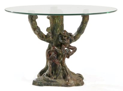 ENZO MISSONI (XXE) 
Pedestal table, circular glass top, resting on a bronze base...