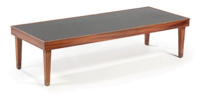 JACQUES ADNET (1900-1984) 
Mahogany coffee table, rectangular black melamine top,...