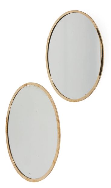 TRAVAIL FRANÇAIS Pair of oval mirrors in gilded brass
H : 71 l : 56 cm