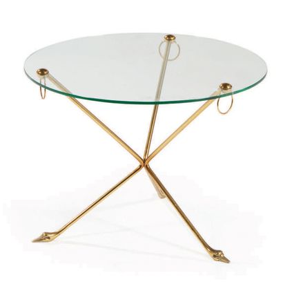 TRAVAIL FRANÇAIS Coffee table with circular glass top resting on a curved ormolu...