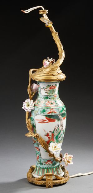 CHINE A small porcelain baluster vase decorated in green family enamels with men...