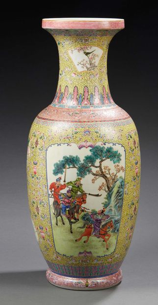CHINE A large baluster-shaped porcelain vase decorated in famille rose enamels with...