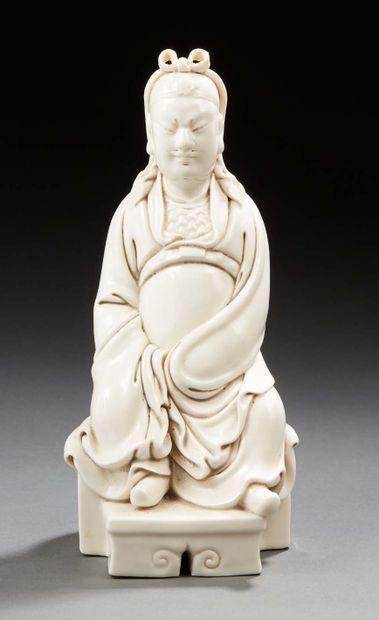 CHINE White enameled porcelain figurine of the god Guandi seated on a throne. Workshop...