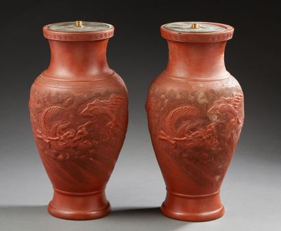 CHINE Two Yixing red stoneware baluster vases decorated with dragons among clouds
Late...