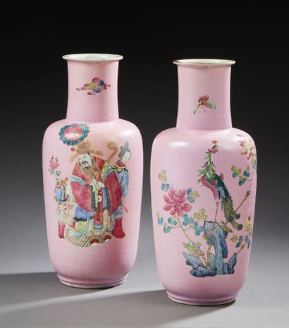 CHINE A pair of narrow-necked cylindrical porcelain vases with a pink background...