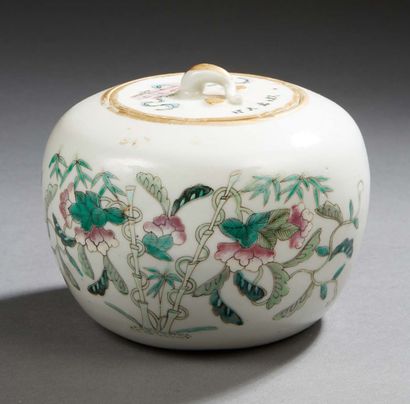 CHINE Circular covered porcelain box decorated in Famille Rose enamels with flowering...