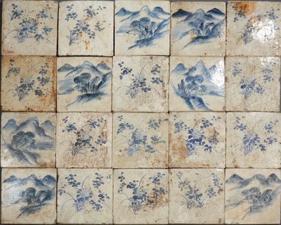CHINE Set of 35 large ceramic tiles decorated in blue with mountains and flowers.
19th...