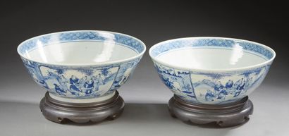 CHINE Two large porcelain bowls decorated in blue underglaze with scenes of characters...