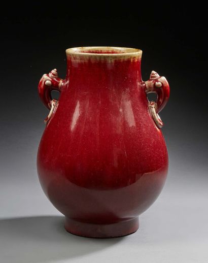 CHINE Porcelain baluster vase with two openwork handles and a monochrome oxblood...