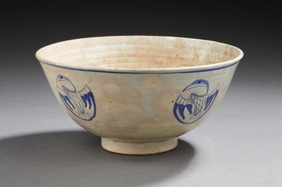 CHINE Ceramic bowl decorated in blue enamel with a phoenix on a white background....