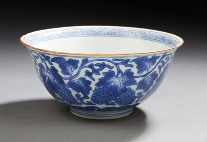 CHINE A circular porcelain bowl decorated in blue underglaze on the outer wall with...