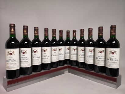 null 12 bouteilles Château de FIEUZAL - Gcc Pessac Léognan En caisse bois. 1986

1...