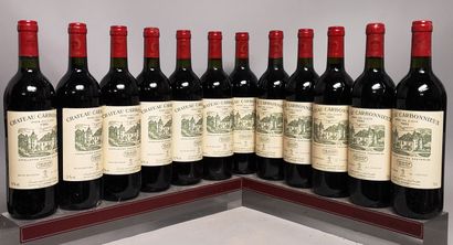 null 12 bouteilles Château CARBONNIEUX - Gcc Pessac Leognan En caisse bois. 1985...