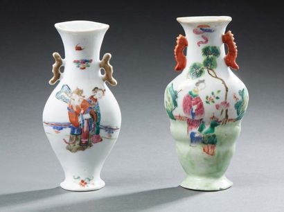 CHINE Two porcelain wall sconces decorated in famille rose enamels with figures in...