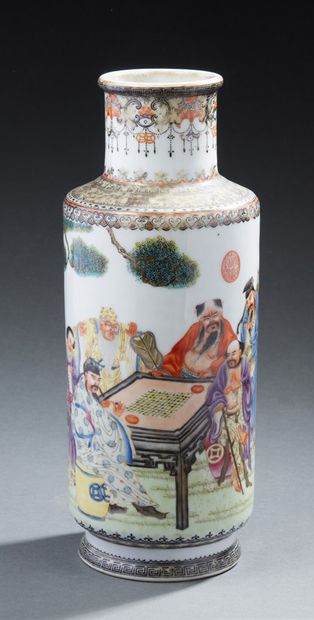 CHINE A porcelain baluster vase decorated in enamel with a lively scene of a game....