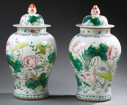 CHINE A pair of large porcelain baluster-shaped covered pots decorated in famille...