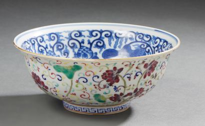CHINE A circular porcelain bowl decorated on the outside with lotus flowers in Famille...