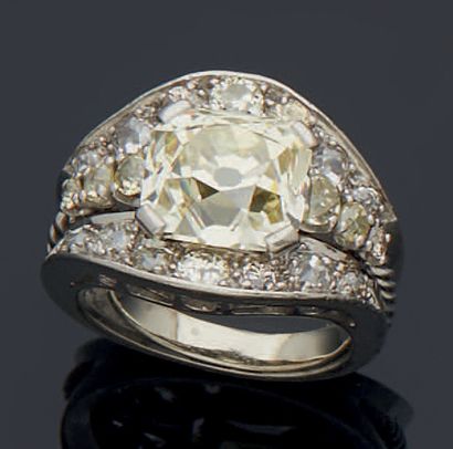 null 850 mm platinum BRIDGE RING, set with a rare tinted naive cut diamond (rondiste...