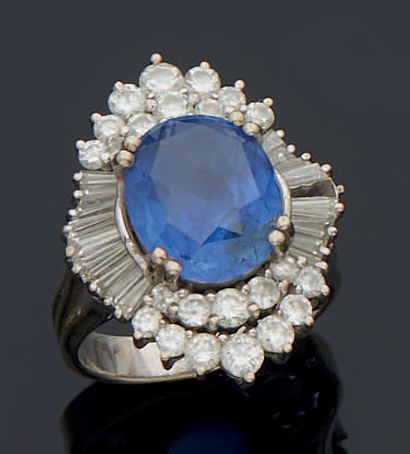 null Skirt ring in 750 mm white gold wire, set with a large oval sapphire weighing...