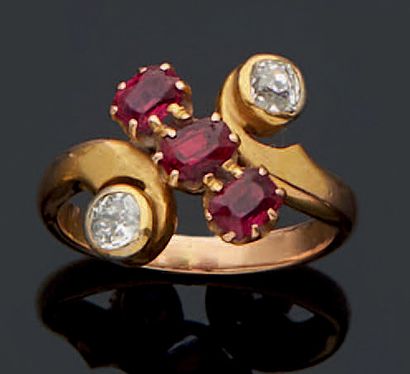 null CROSSED RING in red gold 750 mm, finished with two old-cut diamonds and a line...