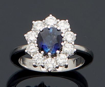 null 
MARGUERITE RING in white gold 750 mm set with a round sapphire in the center...