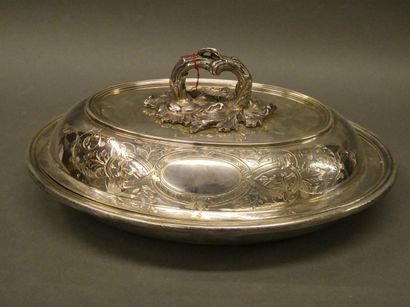 null Silver plated metal covered vegetable dish decorated with foliage scrolls.