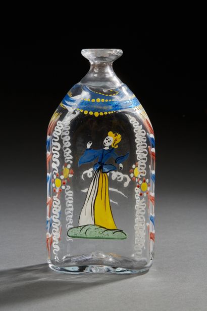 null Small glass bottle with painted decoration of a character and floral motifs...