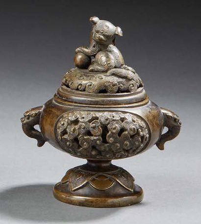 CHINE A covered bronze perfume burner with a brown patina, hemispherical in shape,...