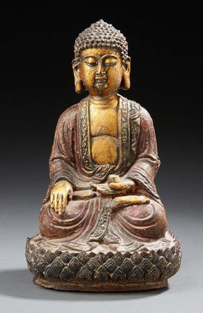 CHINE Cast-iron figure of a seated Buddha in lotus position holding an offering cup...