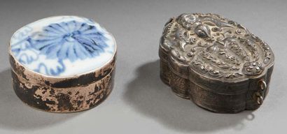 INDOCHINE Two silver boxes. One embossed with an interior compartment and one with...