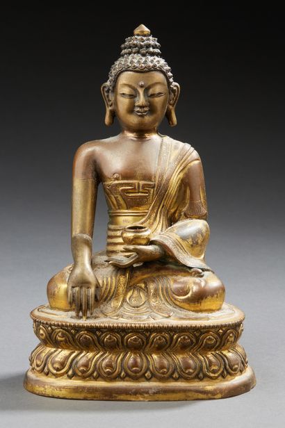 HIMALAYA ? Gilded copper figurine (remains of gilding) representing a seated Buddha...