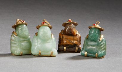 CHINE Four small jadeite and budai tiger eye pendants. 20th century.
H. : 2,5 cm