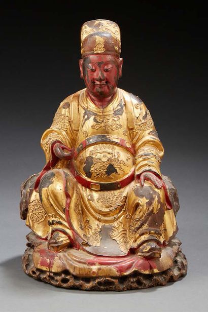 CHINE Carved and gilded wooden statue of Buddha.
XIXth century.
H. : 33 cm