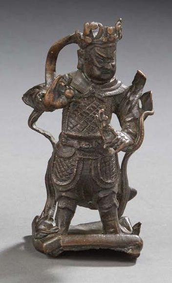 CHINE Statuette en bronze à patine brune figurant guerrier.
XVIIIe/XIXe siècle
H....