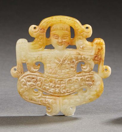 CHINE Ornament in nephrite celadon and rust, acrobat decorated with volutes.
XXth...
