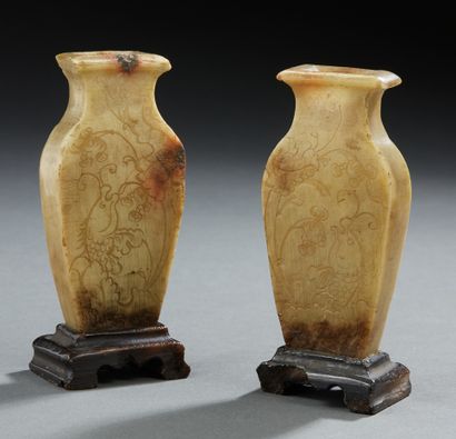 CHINE Two small carved soapstone altar vases of baluster form resting on pedestals,...