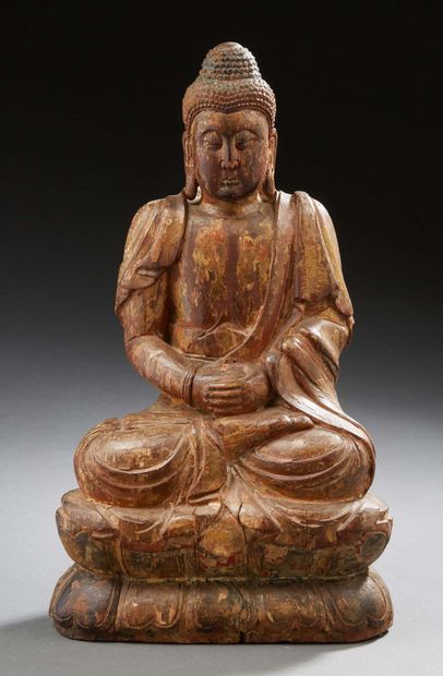 CHINE Lacquered and carved wood Buddha.
18th/19th century.
H. 32 cm