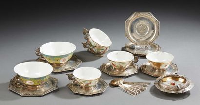 ASIE Set of porcelain cup and saucer with silver setting. Silver spoons are attached.
XXth...