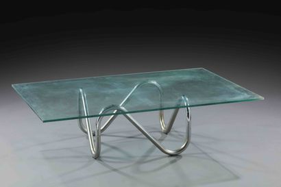 null TRAVAIL 1970

Table basse à plateau rectangulaire en verre reposant sur un piétement...