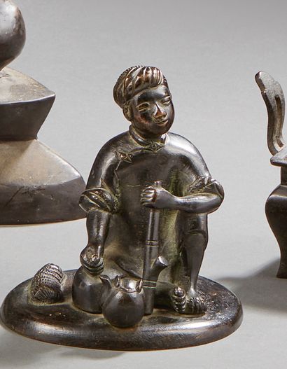 null CHINA


Seated characters in bronze with brown patina. Mark on the back with...