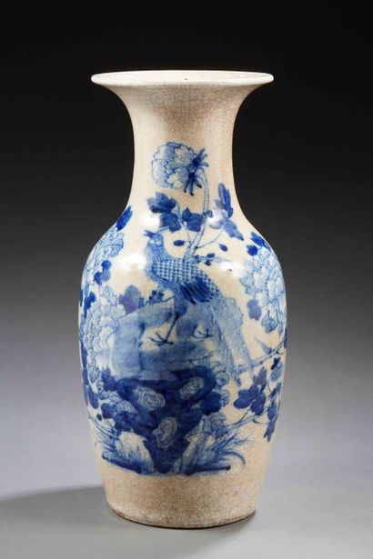 null CHINA


Large cracked porcelain vase decorated in blue underglaze with a peacock...