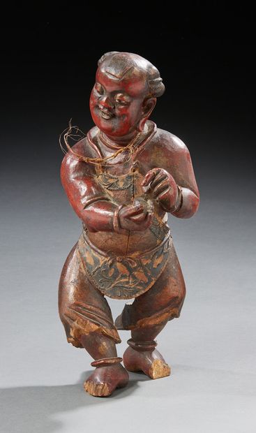 CHINE Wooden statute with brown patina
19th century
H.: 39 cm