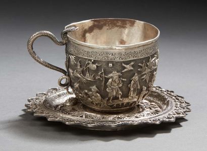 CHINE Chased silver cup and saucer decorated with characters and dragons framing...