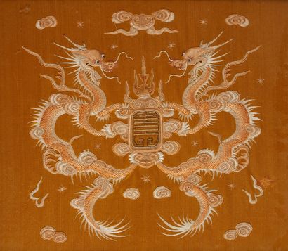CHINE Embroidery showing two dragons framing a seal. About 1900