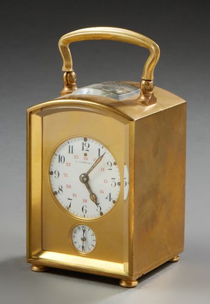 TRAVEL CLOCK with gilt brass case; the enamelled...