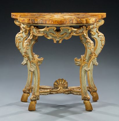 null A carved and gilded wood CONSOLE with pale green rechambering; the aprons are...