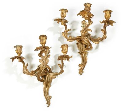 null Pair of three-light chased and gilt bronze sconces with sinuous foliage and...